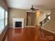 Comfortable living room with hardwood floors, a fireplace, and an open layout for entertaining at 13123 Ashley Meadow Dr, Charlotte, NC 28213