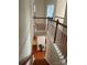 View of staircase with hardwood floors and white railing, leading to the lower level at 13123 Ashley Meadow Dr, Charlotte, NC 28213