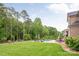 Secluded backyard features a pool, deck with seating, and lush landscaping at 1445 Cherry Laurel Dr, Waxhaw, NC 28173