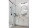 Bright bathroom with white subway tile, walk-in glass shower, and a vanity with a white quartz countertop at 1445 Cherry Laurel Dr, Waxhaw, NC 28173