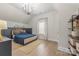 Comfortable bedroom with stylish built-in storage, white walls, and a blue duvet at 1445 Cherry Laurel Dr, Waxhaw, NC 28173