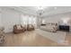 Airy primary bedroom featuring large windows, a tray ceiling, and a neutral color palette at 1445 Cherry Laurel Dr, Waxhaw, NC 28173