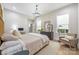 Bright bedroom with large windows, hardwood floors, and stylish decor at 1445 Cherry Laurel Dr, Waxhaw, NC 28173