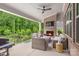 Covered patio with outdoor seating, fireplace, and ceiling fan at 1445 Cherry Laurel Dr, Waxhaw, NC 28173