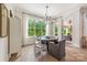Well-lit dining room with a large window and hardwood floors at 1445 Cherry Laurel Dr, Waxhaw, NC 28173