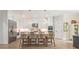 Bright, white kitchen with stainless steel appliances, large island and counter seating at 1445 Cherry Laurel Dr, Waxhaw, NC 28173