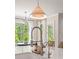 Bright kitchen with stainless steel appliances, pendant lighting, and large window overlooking greenery at 1445 Cherry Laurel Dr, Waxhaw, NC 28173