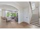 Bright living room with hardwood floors, large windows, and comfortable seating at 1445 Cherry Laurel Dr, Waxhaw, NC 28173