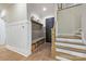 Inviting mudroom with built-in bench, storage cubbies, and access to the staircase at 1445 Cherry Laurel Dr, Waxhaw, NC 28173