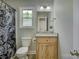 Bathroom with granite vanity, toilet, shower curtain and natural light at 1454 King Rd, York, SC 29745