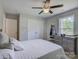 Cozy bedroom featuring ceiling fan, closet space and view from the window at 1454 King Rd, York, SC 29745