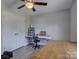Bedroom featuring wood floors, double door closet, ceiling fan and two tables at 1454 King Rd, York, SC 29745