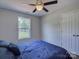 Comfortable bedroom with large window, ceiling fan, and closet space at 1454 King Rd, York, SC 29745