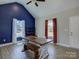 Bright dining room featuring vaulted ceiling, wood floors, and modern table with bench at 1454 King Rd, York, SC 29745