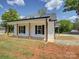 White farmhouse with black shutters and covered front porch at 1454 King Rd, York, SC 29745