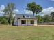 Side view of a charming white home with black shutters and front porch at 1454 King Rd, York, SC 29745