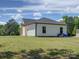 Side exterior of the new white construction home featuring a large grass yard at 1454 King Rd, York, SC 29745
