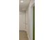 Hallway with white walls, multiple doors, and wood-look flooring at 1454 King Rd, York, SC 29745
