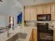 Modern kitchen with light wood cabinets, stainless steel appliances, and granite countertops at 1454 King Rd, York, SC 29745