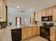 Well-lit kitchen with light wood cabinets, granite countertops, and modern appliances at 1454 King Rd, York, SC 29745