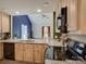 Spacious open kitchen features light wood cabinets and stainless steel appliances at 1454 King Rd, York, SC 29745