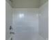 Full view of the bathtub shower with white tile and brushed metal fixtures at 1454 King Rd, York, SC 29745