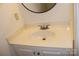 Bathroom vanity showcasing a sleek, white countertop with a neutral-toned sink and a modern faucet fixture at 14621 Waterside Dr, Charlotte, NC 28278