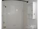 Clean white tiled bathroom with updated fixtures and built-in medicine cabinet at 14621 Waterside Dr, Charlotte, NC 28278