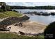Beach area with boat docks visible, providing easy access to the lake for boating and recreation at 14621 Waterside Dr, Charlotte, NC 28278