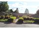 Welcoming community entrance with manicured landscaping and inviting walkway leading to the central amenities at 14621 Waterside Dr, Charlotte, NC 28278