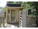 Charming front porch with a decorative white railing and glass-paneled door for inviting curb appeal at 14621 Waterside Dr, Charlotte, NC 28278