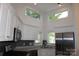 Modern kitchen with stainless steel appliances, granite countertops, and large windows at 14621 Waterside Dr, Charlotte, NC 28278