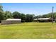 Full backyard shot of the house with the garage and carport at 1512 Mount Ulla Hwy, Mooresville, NC 28115