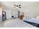 Bedroom with ceiling fan, carpet, two closets and chair at 1512 Mount Ulla Hwy, Mooresville, NC 28115