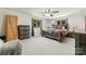 Bedroom with carpet, rustic wood furniture, ceiling fan and natural light at 1512 Mount Ulla Hwy, Mooresville, NC 28115