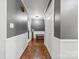 Hallway with neutral paint, white trim, multiple doors, and bench at 1512 Mount Ulla Hwy, Mooresville, NC 28115