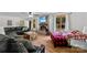 Comfortable living room featuring a brick fireplace, tv, and large windows with natural light at 1512 Mount Ulla Hwy, Mooresville, NC 28115