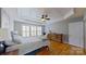 Bright bedroom with a coffered ceiling and shuttered windows providing ample natural light at 15215 Arleta Cir, Charlotte, NC 28277
