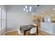 Cozy dining area featuring an elegant lighting fixture and an open view to the kitchen at 15215 Arleta Cir, Charlotte, NC 28277
