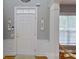 Inviting foyer with hardwood floors, elegant wainscoting, and a well-lit entrance at 15215 Arleta Cir, Charlotte, NC 28277