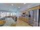 Well-lit kitchen with stainless steel appliances, granite countertops, and views to the dining area at 15215 Arleta Cir, Charlotte, NC 28277