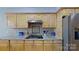 Well-equipped kitchen featuring granite countertops, stainless steel appliances, and ample cabinet space at 15215 Arleta Cir, Charlotte, NC 28277