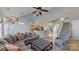 Spacious living room with a fireplace, hardwood floors, and an open view to the kitchen and staircase at 15215 Arleta Cir, Charlotte, NC 28277
