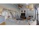 Comfortable living room with high ceilings, fireplace, and staircase access at 15215 Arleta Cir, Charlotte, NC 28277