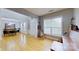Bright and airy living room with hardwood floors, dining area, and large windows at 15215 Arleta Cir, Charlotte, NC 28277