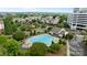 Aerial view of a refreshing community pool surrounded by lush landscaping and residential buildings at 15215 Arleta Cir, Charlotte, NC 28277