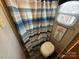 Small RV bathroom with toilet, shower curtain, and window at 164 Dogwood Cir, New London, NC 28127