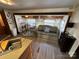 Cozy RV living room featuring a comfortable sofa, dining table, and kitchenette with modern amenities at 164 Dogwood Cir, New London, NC 28127
