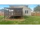 Fenced backyard with a covered porch and a lush, green lawn at 177 Jacobs Woods Cir, Troutman, NC 28166