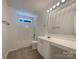 Bright bathroom features a shower-tub combo and single-sink vanity at 177 Jacobs Woods Cir, Troutman, NC 28166